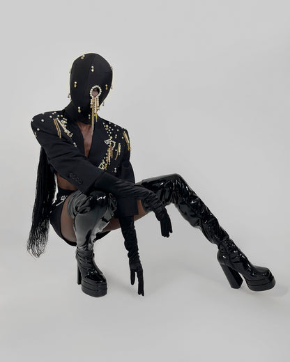 Nadéne luxury black fashion mask with pearls and chains, one eye cut-out design.